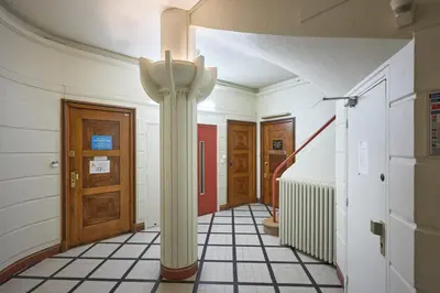 a hallway with a column in the middle of a room at Sunlight Properties - Daffia - Beautifully renovated studio, city pad in Central Nice in Nice