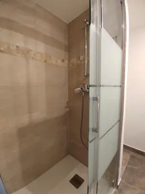 a shower with a glass door in a bathroom at 2 à 6 personnes - WELCOME TO NICE ! LOGEMENT PORT in Nice