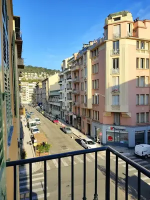 a view from a balcony of a street with buildings at 2 à 6 personnes - WELCOME TO NICE ! LOGEMENT PORT in Nice