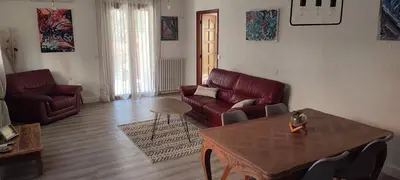 a living room with a couch and a table at LA CASA in Cagnes-sur-Mer