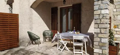a table and chairs sitting outside of a building at LA CASA in Cagnes-sur-Mer