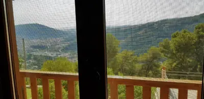 a view of a mountain view from a window at Le Chalet de la Pierreraie Côte d'Azur Piscine Terrasse et Vue Mer in Drap