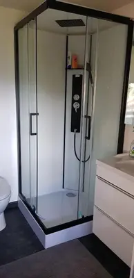 a shower with a glass enclosure in a bathroom at Le Chalet de la Pierreraie Côte d'Azur Piscine Terrasse et Vue Mer in Drap