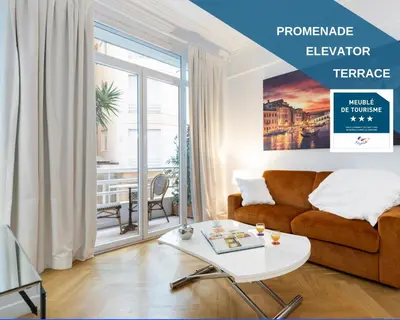a living room with a couch and a table at Promenade, 2pièces chic et clim avec terrasse Location éligible au Bail Mobilité Mobility Lease in Nice