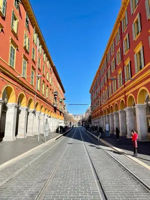 an empty street in a city with tall buildings at Un havre de paix et de calme en plein centre de Massena in Nice