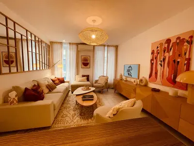 a living room with a couch and a table at Nice Renting - PAGANINI - Spacious Apartment - 2 BedRooms - King Bed - Bathtub - Heart of Nice in Nice