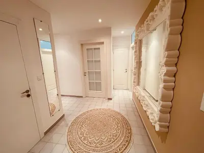 a hallway with a door and a rug at Nice Renting - PAGANINI - Spacious Apartment - 2 BedRooms - King Bed - Bathtub - Heart of Nice in Nice