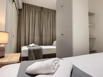a hotel room with two beds and a window at Nestor&Jeeves - MARIA BEACH - Central - By sea in Nice