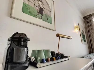 a coffee machine sitting on a table next to a lamp at Nestor&Jeeves - MARIA BEACH - Central - By sea in Nice