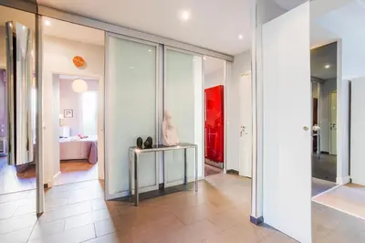 a hallway with a table with a statue on it at LE TIVOLI AP4264 By Riviera Holiday Homes in Nice