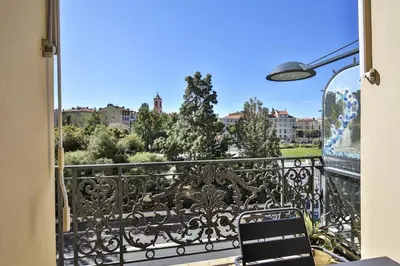 a balcony with a view of a city at Balcon vue Coulée Verte. Luxe Plein cœur de Nice in Nice