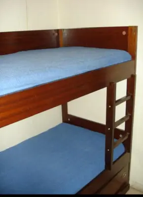 a bunk bed with a blue mattress on it at appartement bord de mer avec piscine in Cagnes-sur-Mer
