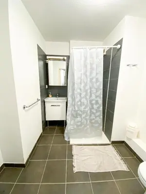 a room with a mirror and a walk in closet at City Résidence Nice in Nice