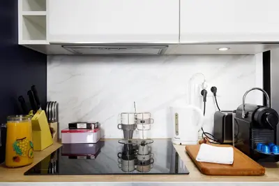 a kitchen with a counter top with a coffee maker at Maison Bianchi - Old Town Flower market in Nice