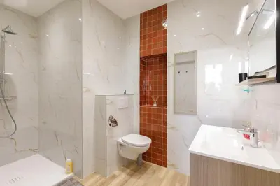 a bathroom with a toilet and a sink and a shower at Maison Bianchi - Old Town Flower market in Nice