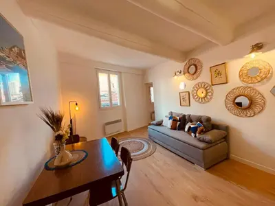 a bathroom with a toilet in the corner of a room at Appart Hotel Jaures - Boutique apartments in Nice