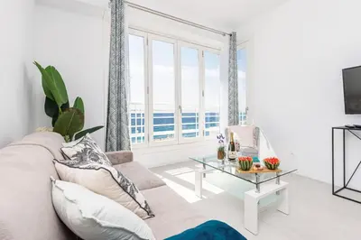 a living room with a couch and a table at MY CASA - PROM 163 - 2 rooms with terrace Promenade des Anglais in Nice