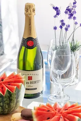 a bottle of champagne and a glass of wine at MY CASA - PROM 163 - 2 rooms with terrace Promenade des Anglais in Nice