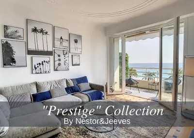 a living room with a couch and a view of the ocean at Nestor&Jeeves - BLUE PROMENADE - Sea front - Central - Luxe in Nice