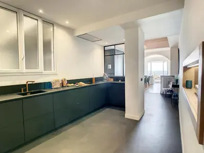 a kitchen with green cabinets and a large window at Nestor&Jeeves - BLUE PROMENADE - Sea front - Central - Luxe in Nice
