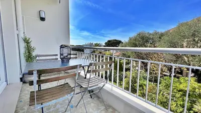 a balcony with a bench and a view at LA LANTERNE in Nice