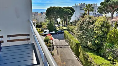 a view of a street from a balcony of a building at LA LANTERNE in Nice