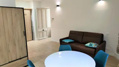 a living room with a couch and a table at hypercentre lamartine 001 in Nice