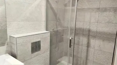 a shower with a glass door in a bathroom at hypercentre lamartine 001 in Nice