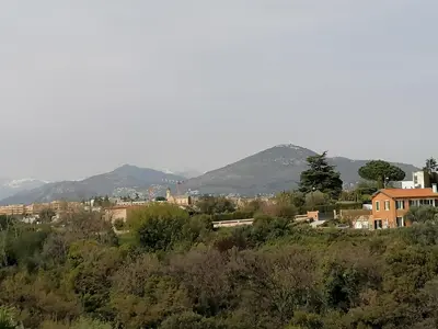 a view of a city with mountains in the background at Studio Anoe in Nice