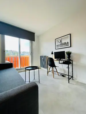 a bedroom with a bed and a desk with a computer at Nice Promenade 2 in Nice
