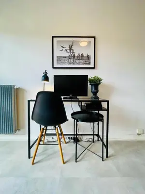 a room with a desk with a computer and two chairs at Nice Promenade 2 in Nice
