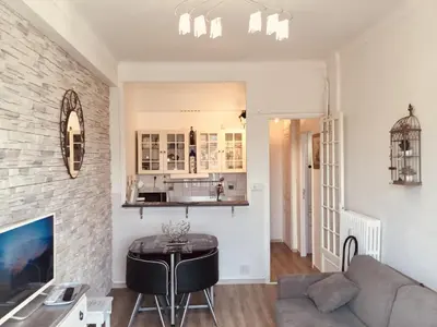 a living room with a couch and a table at Studio Bel Air FSHH in Nice