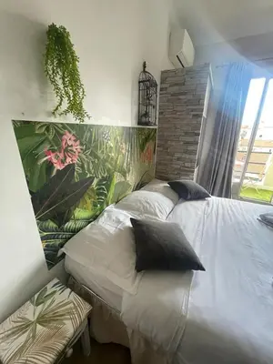 a bedroom with two twin beds with pillows at Studio Bel Air FSHH in Nice