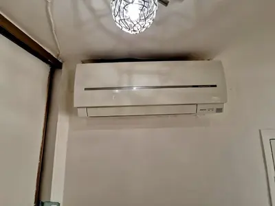 a light hanging from the ceiling of a bathroom at Le Cosy - Place Masséna in Nice