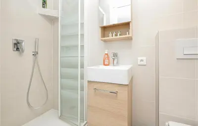 a bathroom with a shower and a sink at Lovely Home In Saint-Laurent-Du-Var in Saint-Laurent-du-Var