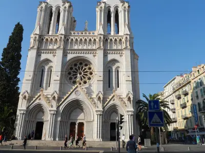 a large white church with a tall tower at Appartement du Thiers in Nice