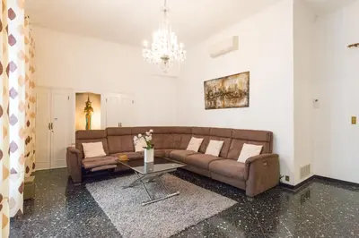 a living room with a couch and a table at Appartement du Thiers in Nice
