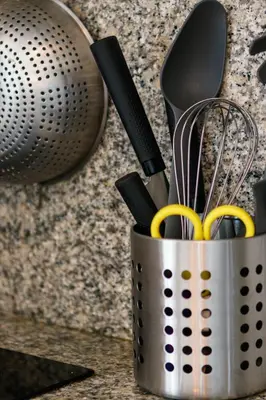 a metal container filled with utensils on a counter at Apart Nissa Bella Centre / Promenade des Anglais in Nice