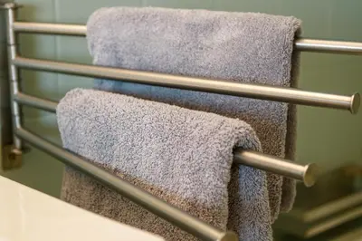 a group of towels hanging on a towel rack at Apart Nissa Bella Centre / Promenade des Anglais in Nice