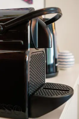 a black toaster oven sitting on a kitchen counter at Apart Nissa Bella Centre / Promenade des Anglais in Nice