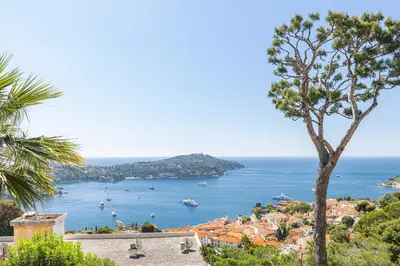 a view of a bay with boats in the water at Extraordinary Sea View - 1 Bdr with AC in Villefranche-sur-Mer