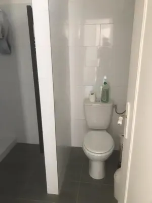 a bathroom with a white toilet in a stall at Villa Le Rêve in Nice