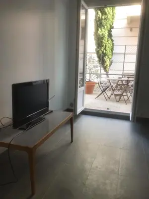 a television sitting on a table in a living room at Villa Le Rêve in Nice