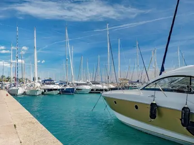 a boat is docked in a marina with other boats at Apartment Le Giono by Interhome in Saint-Laurent-du-Var
