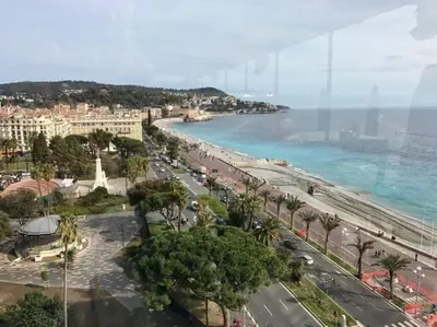 a view of a city with a beach and the ocean at Joli 3 pièces, 7 pers, très lumineux, Nice centre in Nice