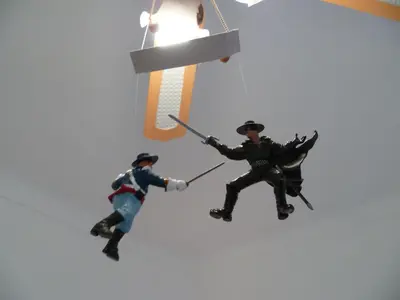 two toy figurines of two men hanging from a light at Joli 3 pièces, 7 pers, très lumineux, Nice centre in Nice
