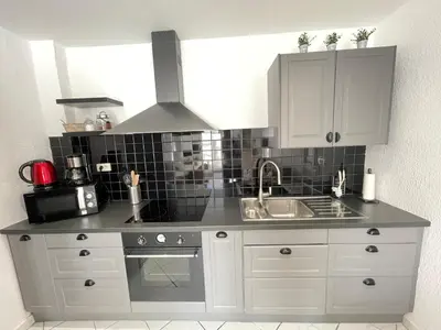a kitchen with white cabinets and a sink at Nice Renting - 9 MASSENA - Spacious apartment Massena Square - AC - fully equipped in Nice