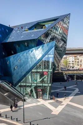 a large glass building with people walking around it at Homelivia, ATTIC ROOM -Mansardé sous les toits de Nice in Nice