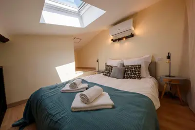 a bedroom with a bed with towels on it at 06A2 - Heart of Old Nice beautiful renovated apartment in Nice
