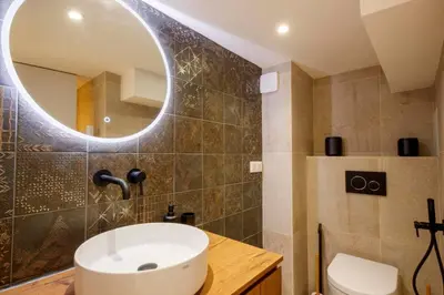 a bathroom with a sink and a mirror at 06A2 - Heart of Old Nice beautiful renovated apartment in Nice